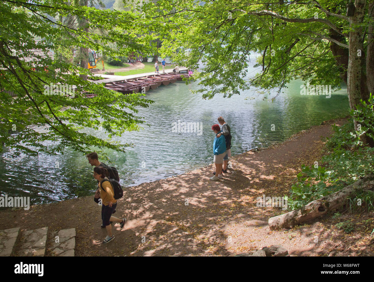 People enjoying Plitvice Lakes National Park, Croatia. A UNESCO World Heritage site, this natural wonder contains 16 lakes interconnected by rivers an Stock Photo