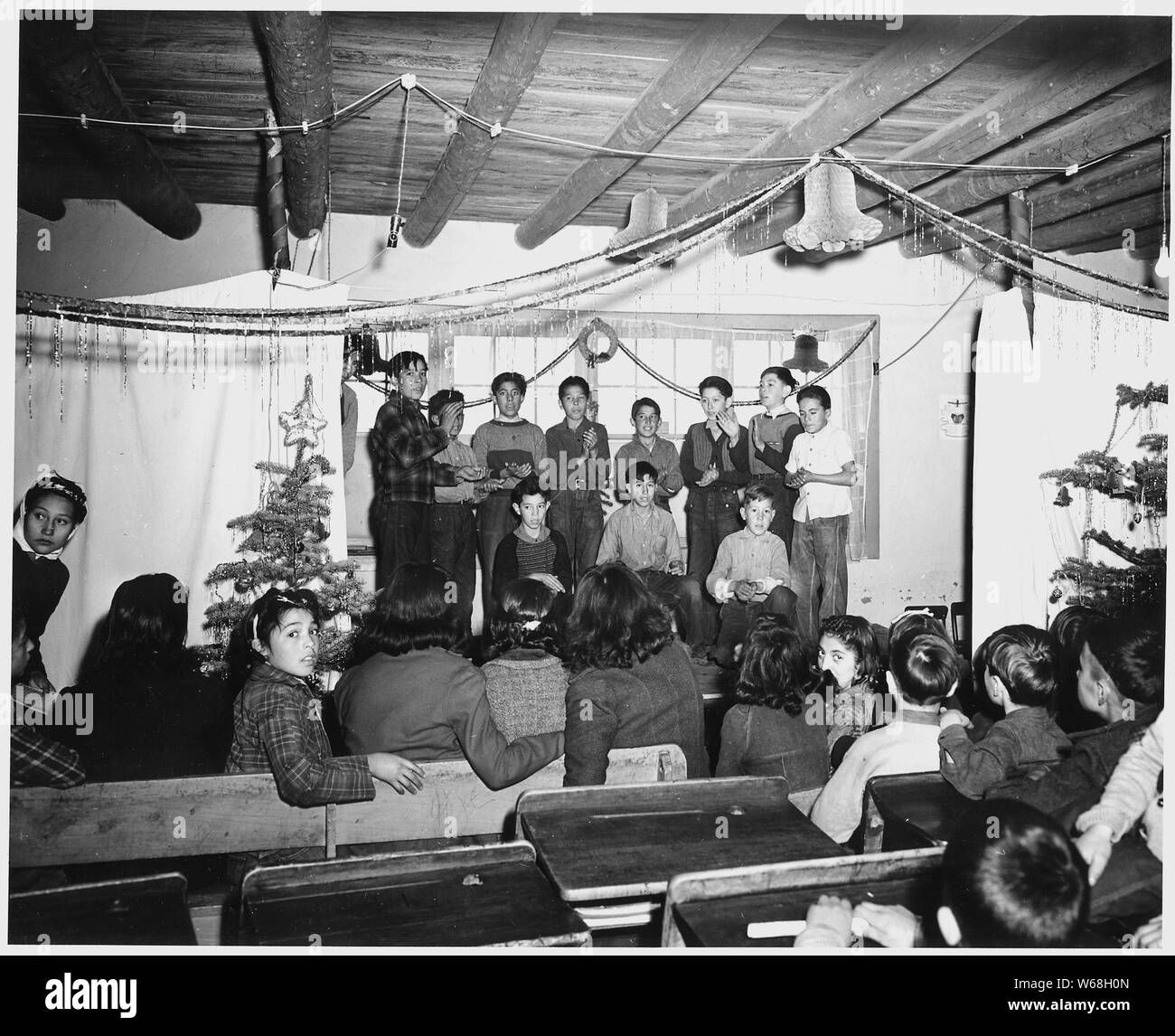 Taos County, New Mexico. Pupils of the Prado school rehearse their Christmas play.; Scope and content:  Full caption reads as follows: Taos County, New Mexico. Pupils of the Prado school rehearse their Christmas play. Stock Photo