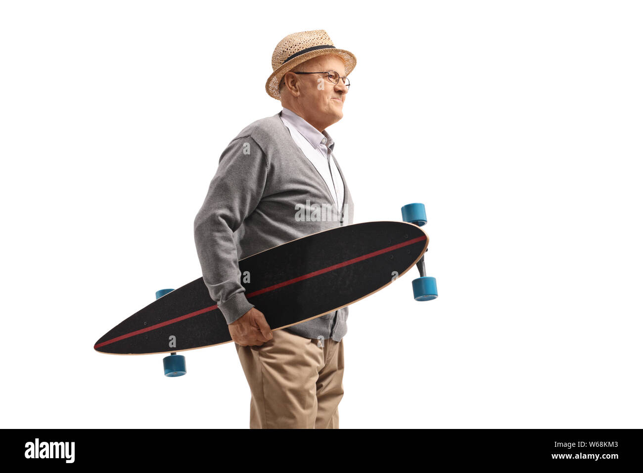 Elderly man holding a longboard isolated on white background Stock Photo