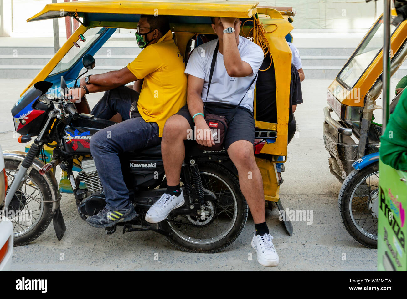 A Tricycle Transporting Tourists, Boracay, Aklan Province, The Philippines Stock Photo