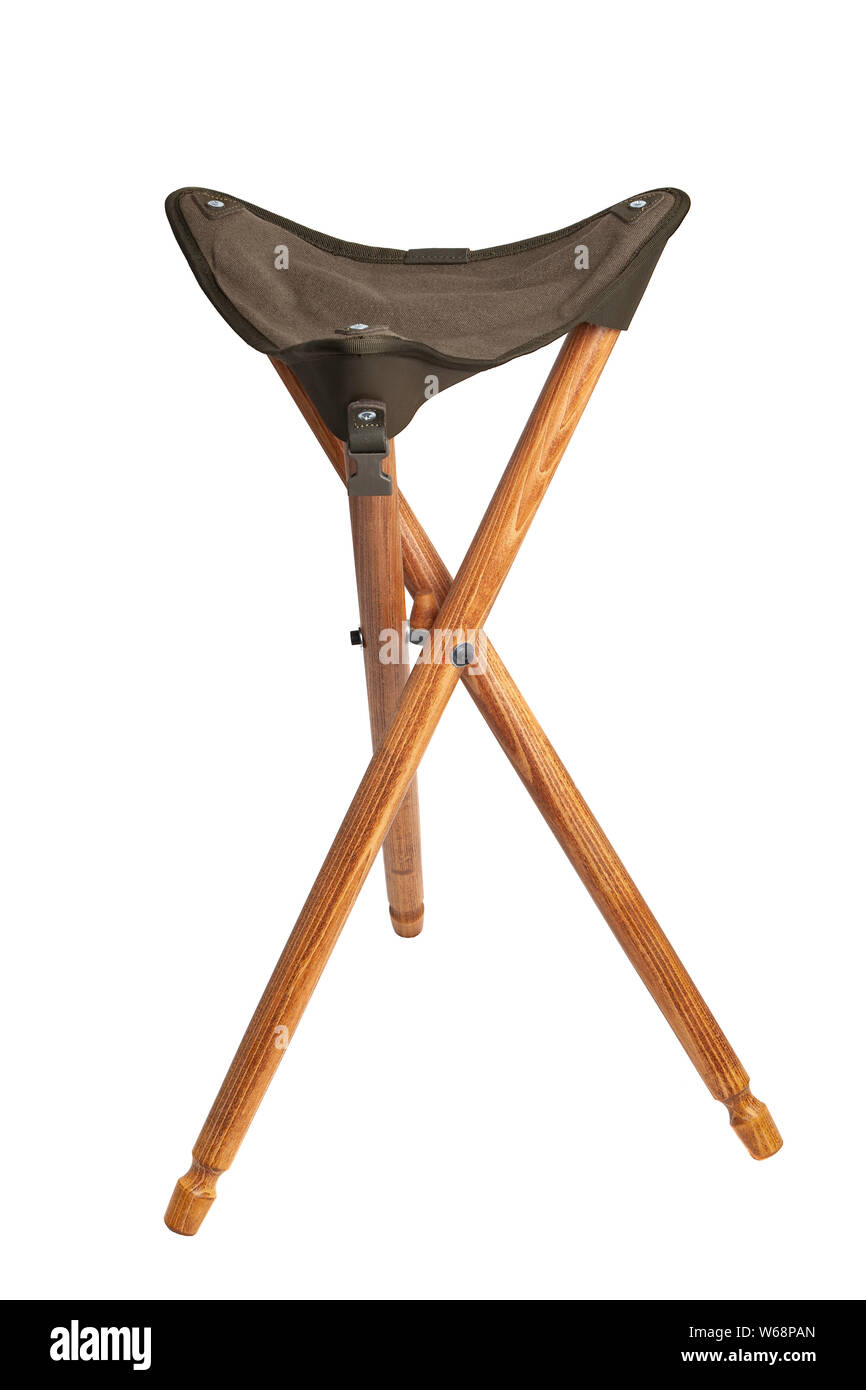 Folding wooden hunting stool tripod isolate on white background. Three-legged camping chair. Stock Photo