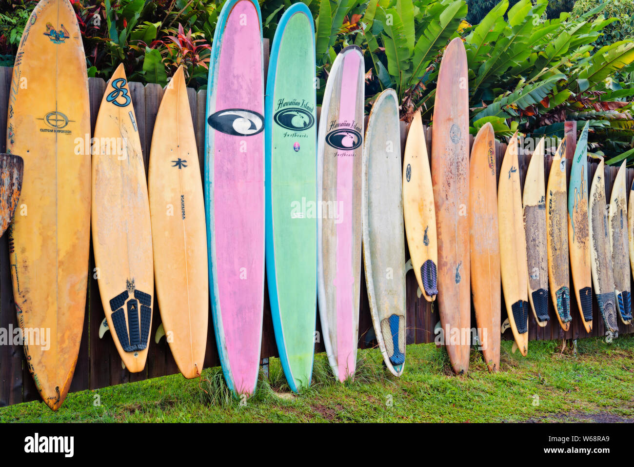 Colorful surfboard fence near the town of Paia along the Road to Hana on Hawaii’s Island of Maui. Stock Photo