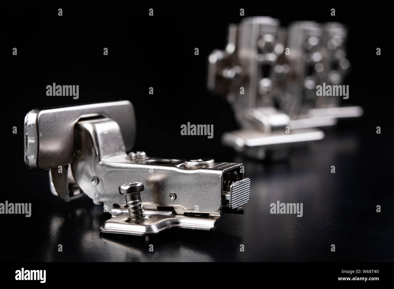 Metal furniture hinges with hydraulic brake. Furniture accessories for