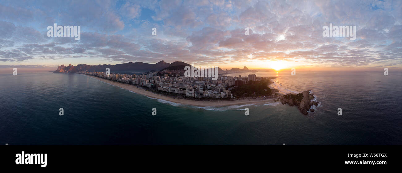 Sunrise 360 degree full panoramic aerial view of Rio de Janeiro with Arpoador and Ipanema beach in the foreground and the wider cityscape behind Stock Photo