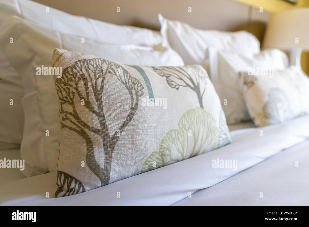 Image Of Several Pillows On Bed With White Blanket Decoration