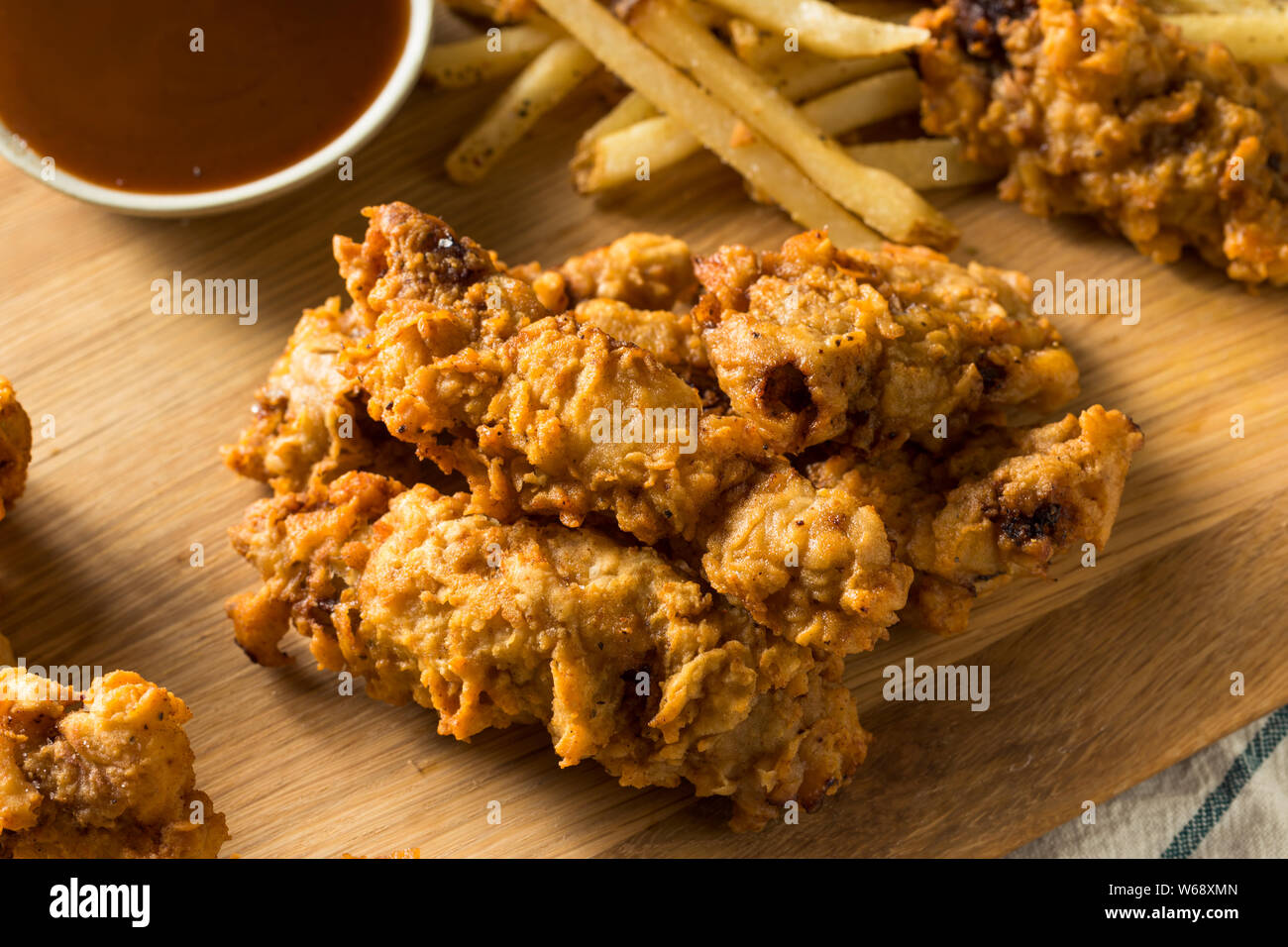 https://c8.alamy.com/comp/W68XMN/homemade-deep-fried-idaho-finger-steaks-with-fries-W68XMN.jpg