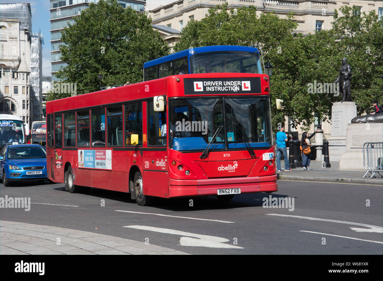 A trainee bus driver negotiates the traffic around Trafalgar Square Stock Photo