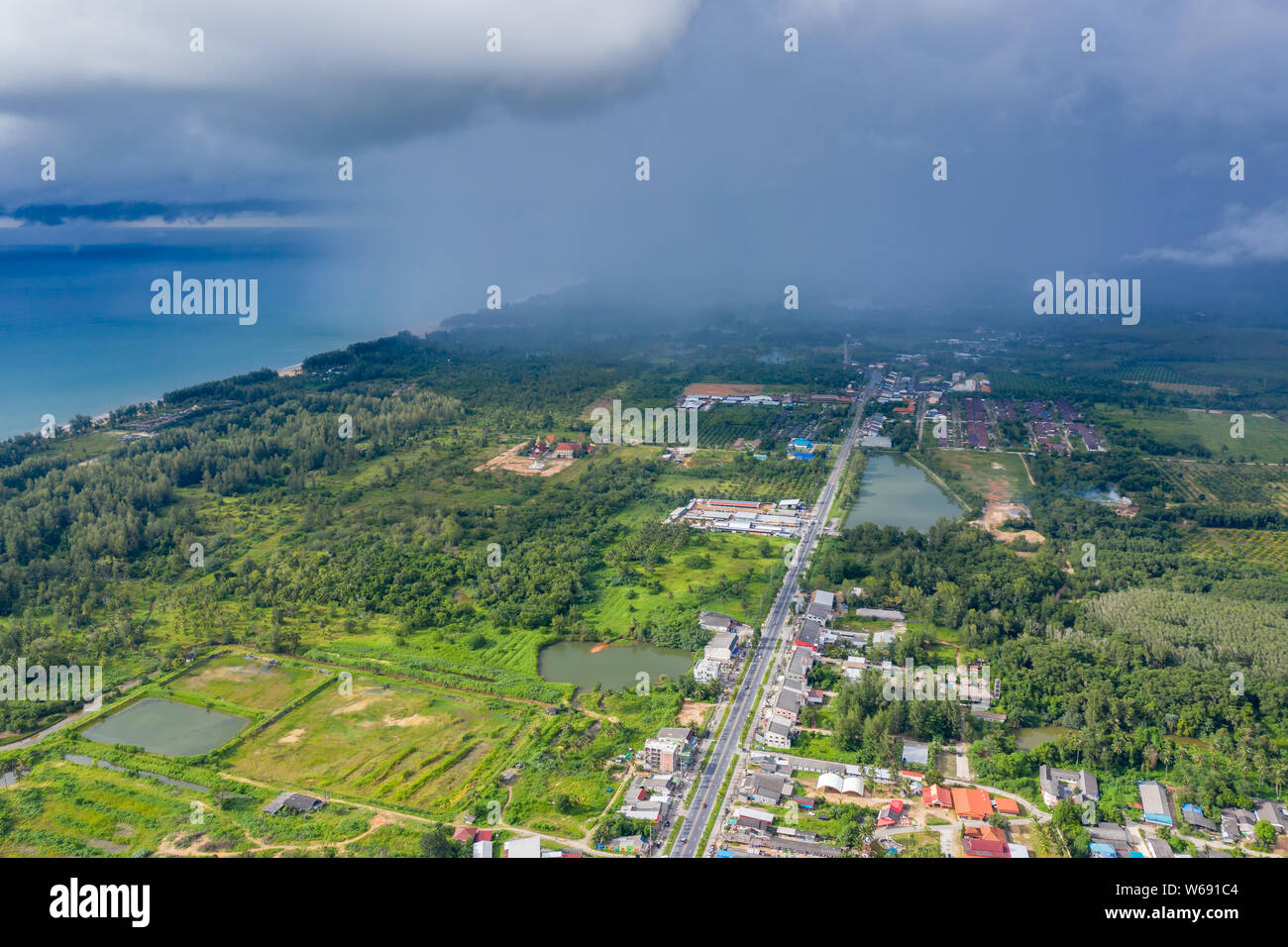 Aerial drone view of an approaching rain and thunderstorm over a coastal area Stock Photo