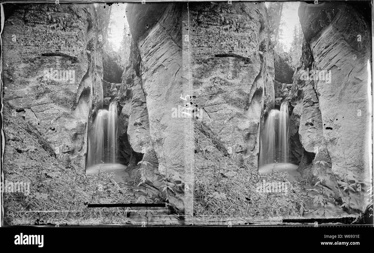 Winslow Creek. Utah, Annus Glen. Similar to 421 which is a close up view of the falls. Hillers photo. (Now called Pine Creek, but shown as Winslow Creek on the Escalante 1:250,000 Quad Map, 1886, by Powell Survey, NC, 1/1968). Old nos. 283, 427, 437, 869. Stock Photo