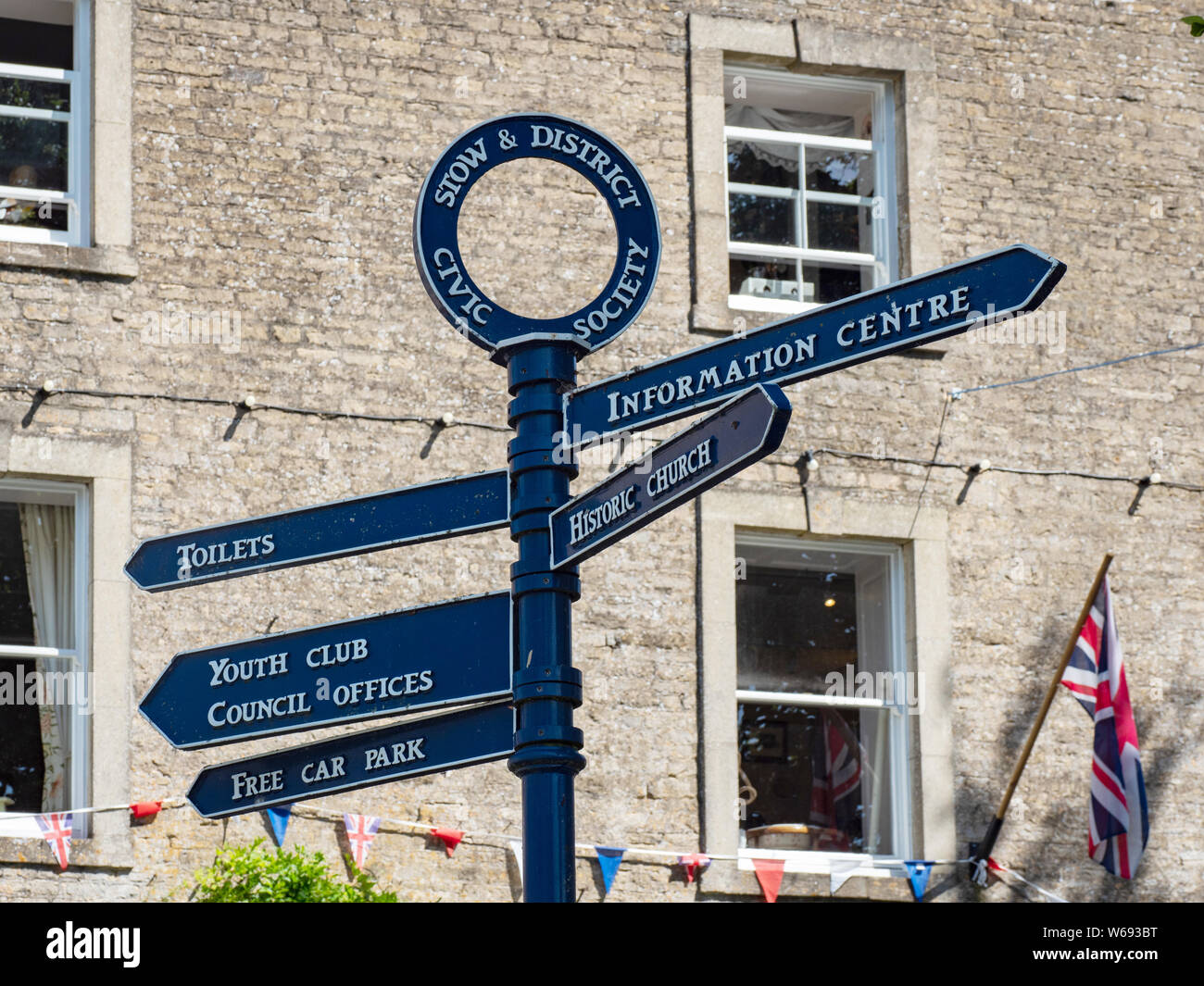 A sign post in Stow on the Wold, Gloucestershire, England, UK. Stock Photo