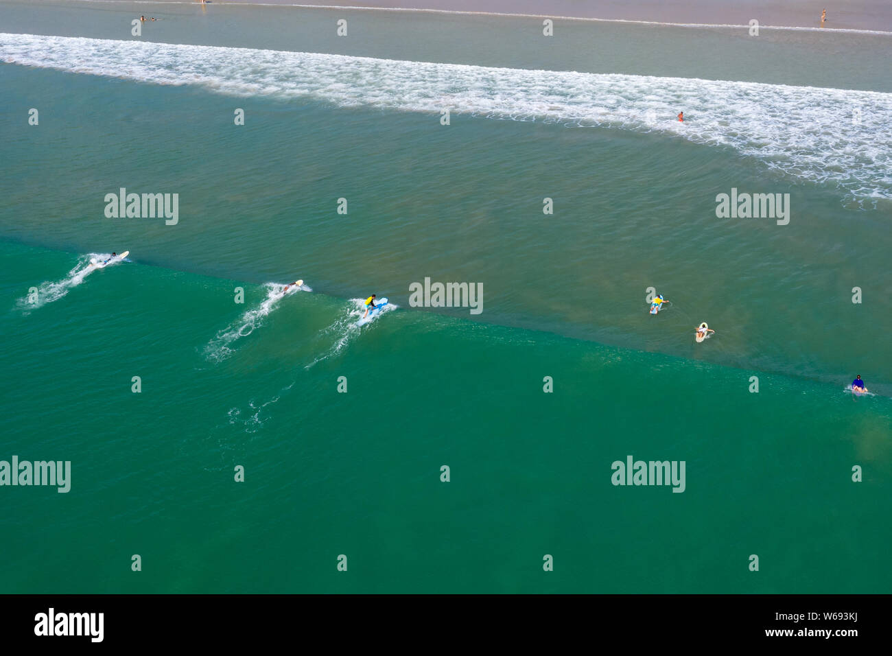 Aerial drone view of surfers in action off Memories Beach, Khao Lak, Thailand Stock Photo