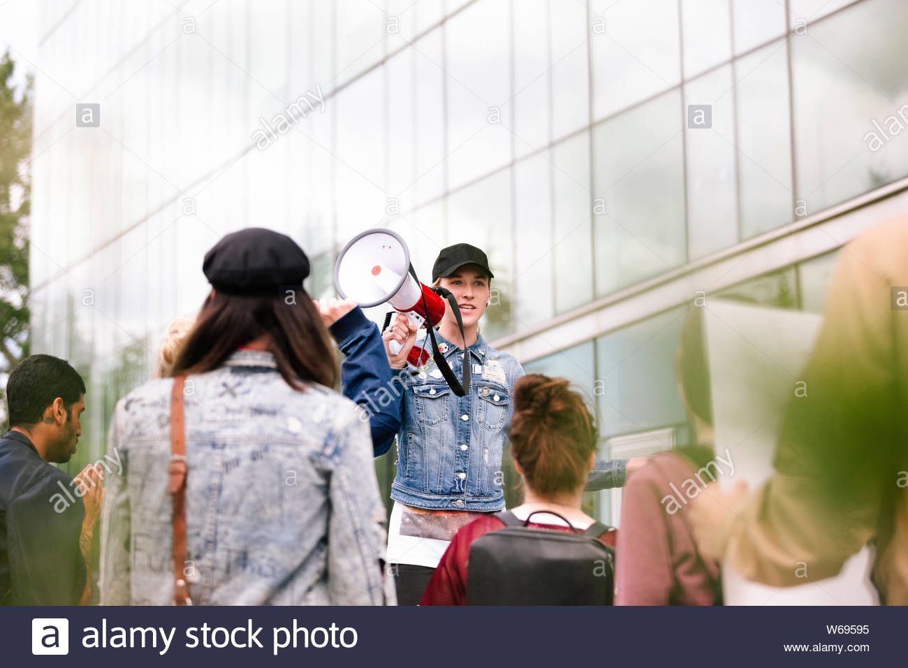 Student with megaphone on protest march Stock Photo