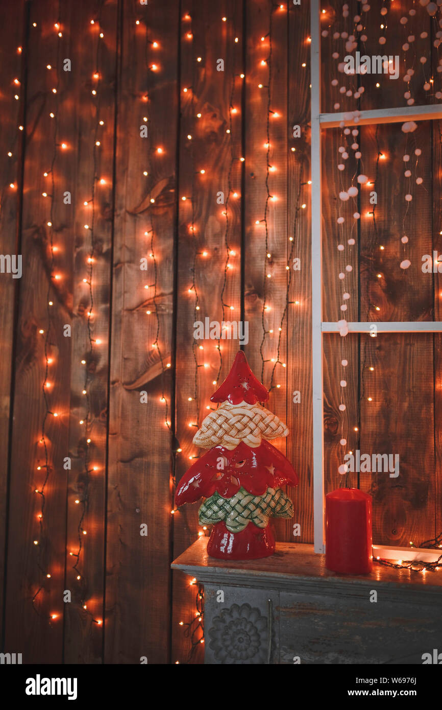 Christmas Decorations On The Fireplace And A Glowing Yellow