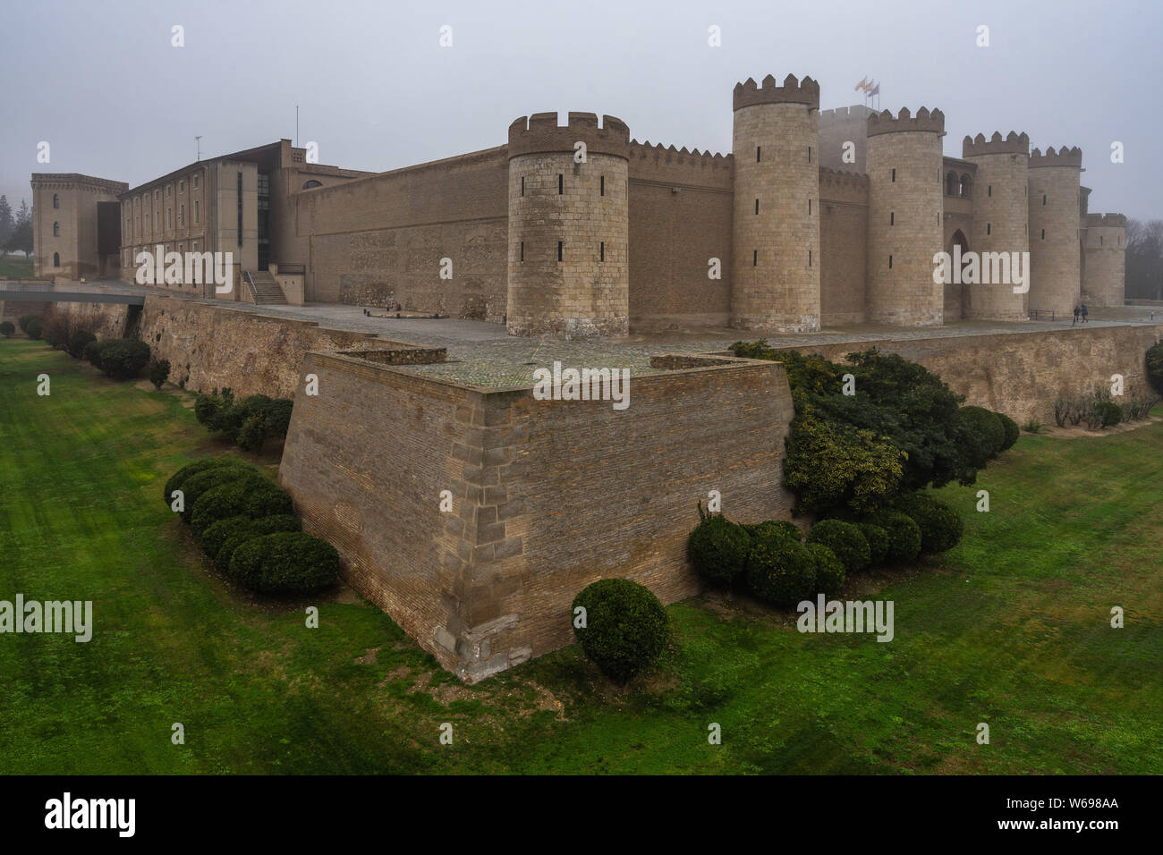 View of Aljaferia Palace in a foggy winter day, Zaragoza, Aragon, Spain Stock Photo
