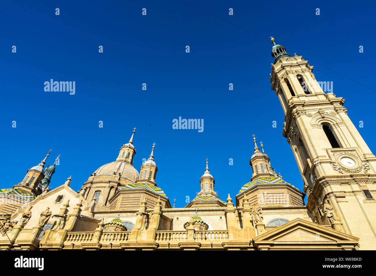 Wide angle view of cupolas and tower bell of the Cathedral of Our Lady of the Pillar, a fine example of Baroque style architecture, Zaragoza, Spain Stock Photo
