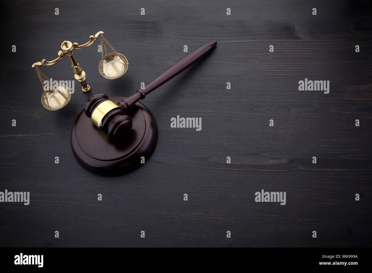 Judges Gavel And Scale Of Justice On The Black Table Background. Law Concept. Stock Photo