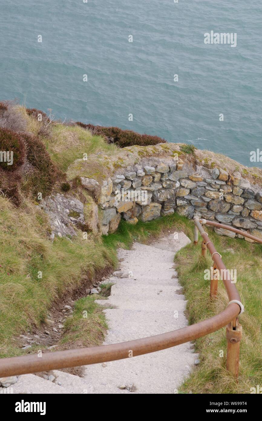 Steep Granite Steps on a section of the south West Coast Path around St Agnes Head on a Spring Day. North Cornwall, UK. Stock Photo