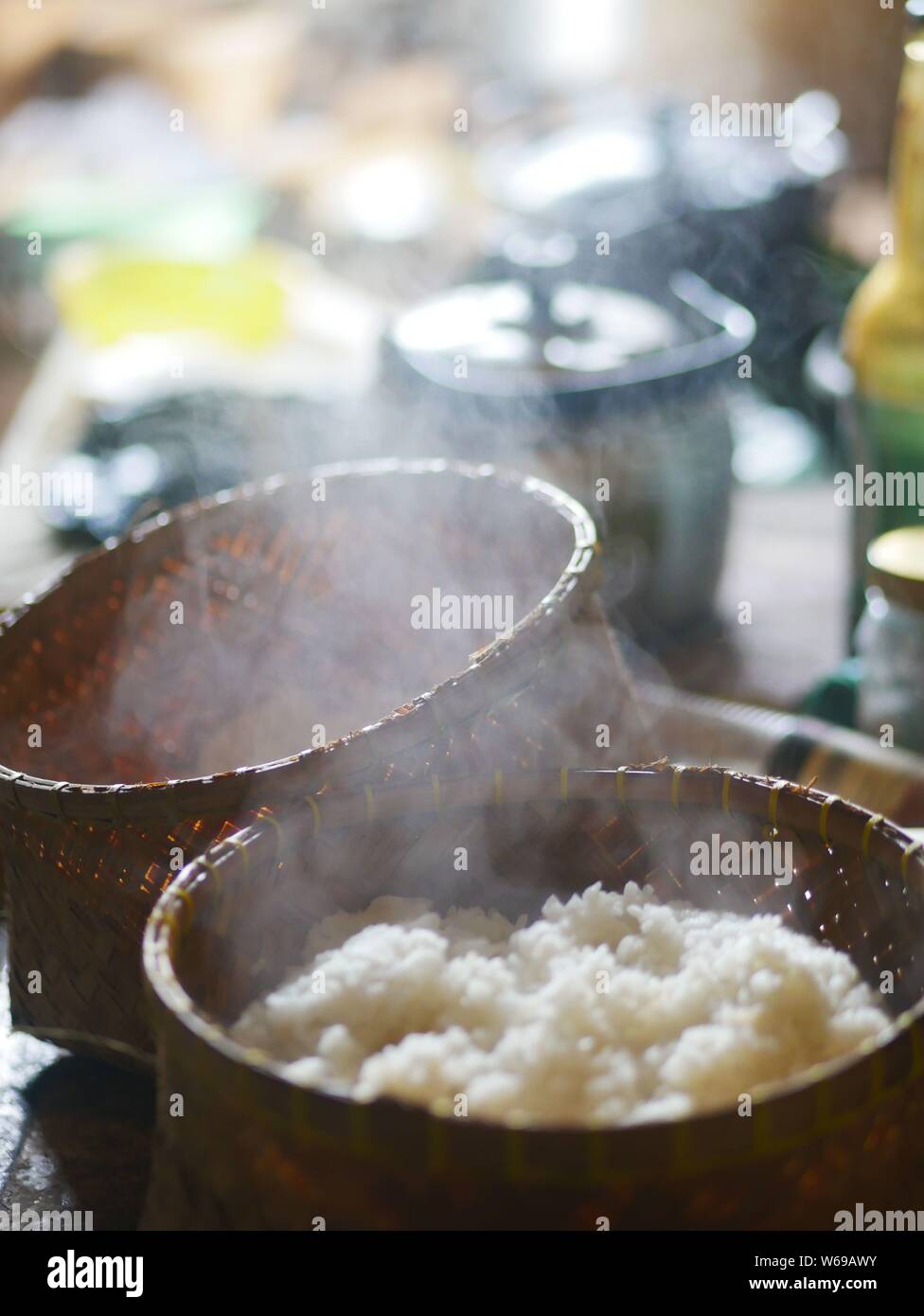 Warm rice in a bamboo basket. Stock Photo