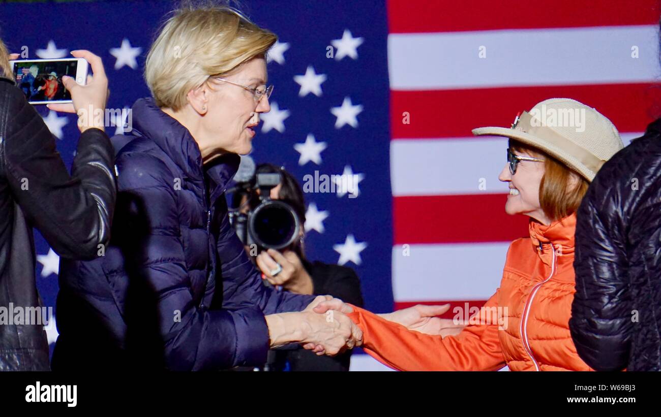 May 31, 2019. Elizabeth Warren for United States President campaign rally, Oakland, California.  Shaking hands with a voter in front of American flag. Stock Photo