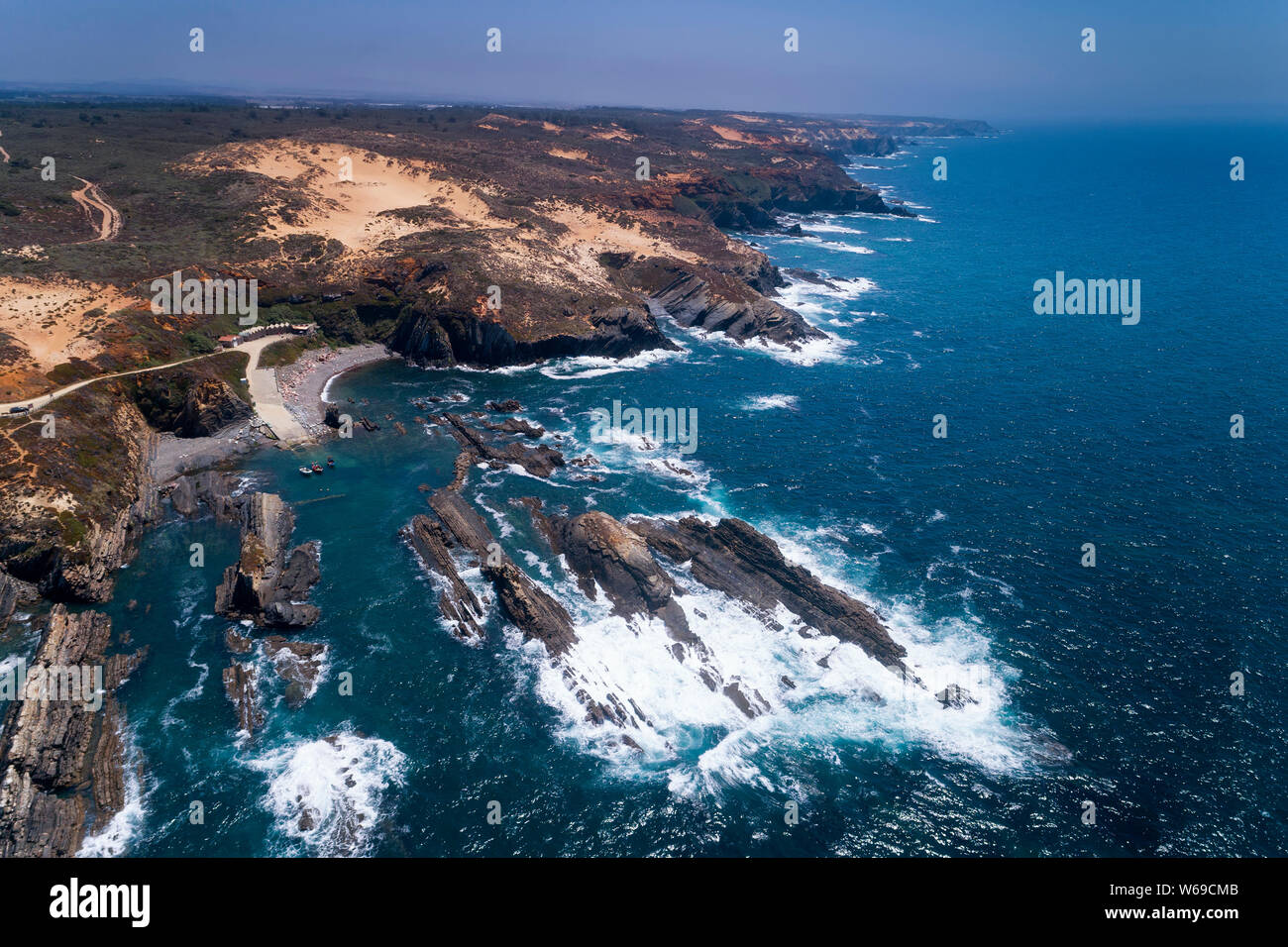 Scenic aerial view of the Lapa das Pombas fishing harbour near the Almograve beach, in Alentejo, Portugal; Concept for travel in Portugal Stock Photo