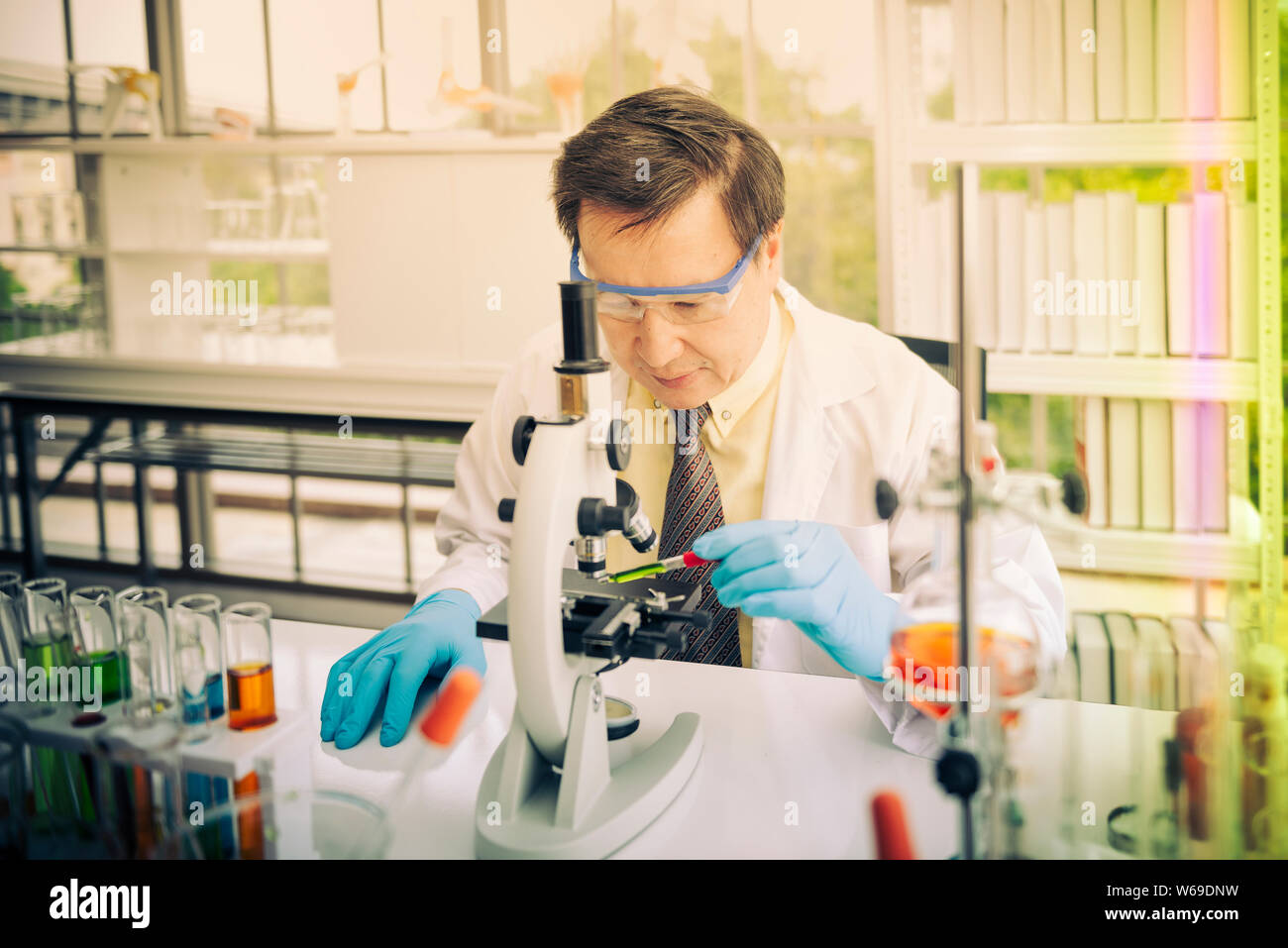Professor testing chemistry in lab Stock Photo - Alamy
