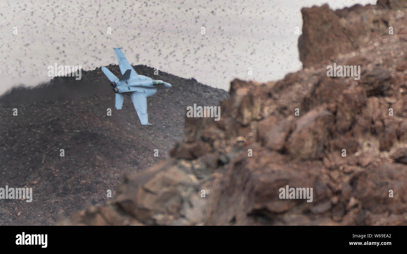 F-18 makes a high speed pass up to 500 mph through Rainbow/StarWars Canyon the Jedi Transition in Panamint Spring/ Death Valley Monday/Tuesday. Many different kinds of jet fighters practice their low flying attack runs during Red-Flag operations this month, March 18-19, 2019. Photo by Gene Blevins/ZumaPress. Credit: Gene Blevins/ZUMA Wire/Alamy Live News Stock Photo