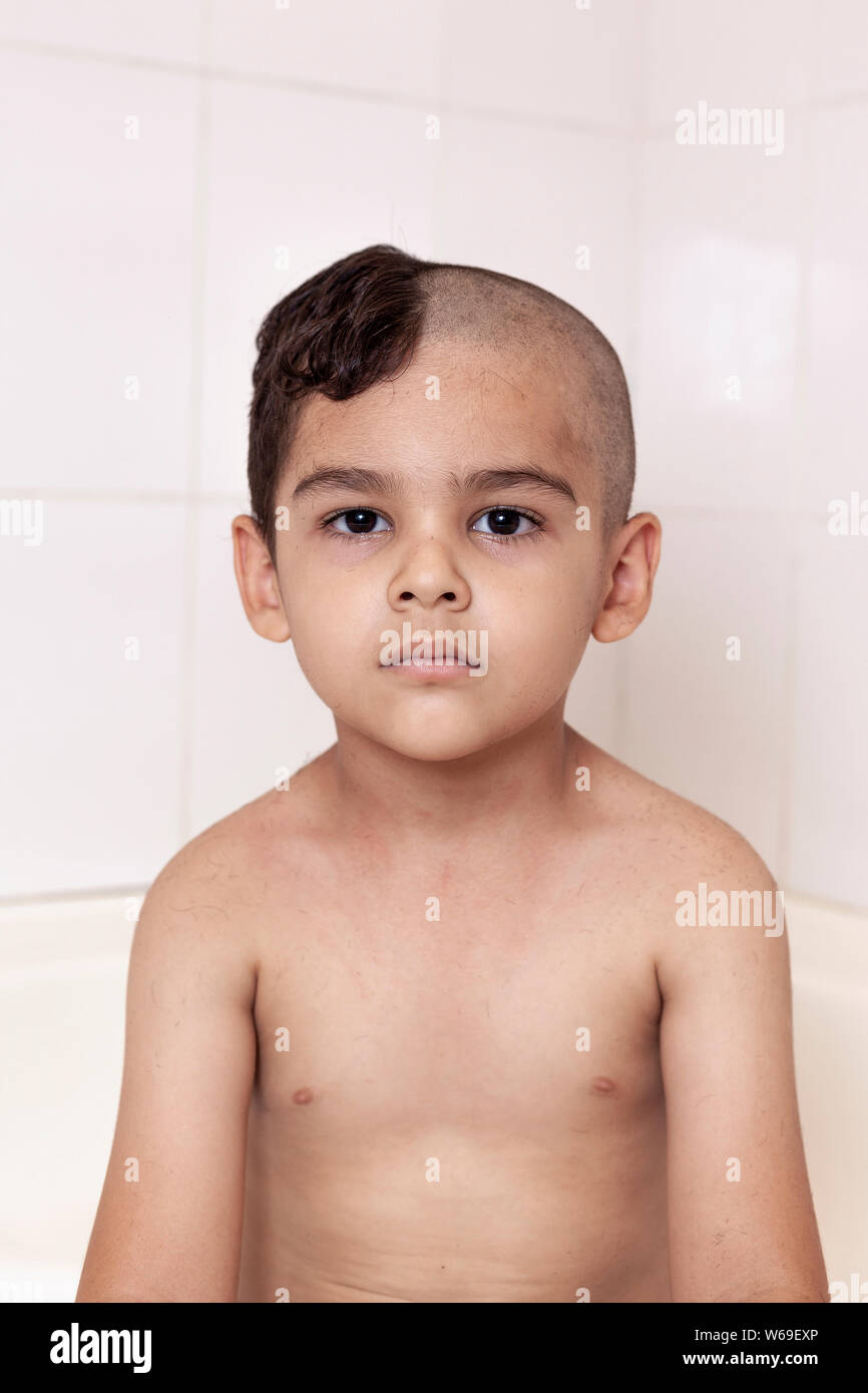 Portrait of a little middle eastern boy at the bathroom. 6-year-old pretty kid with half-cut hair at home Stock Photo - Alamy Portrait of a little middle eastern boy at the bathroom. 6-year-old pretty kid with half-cut hair at home Stock Photo - Alamy