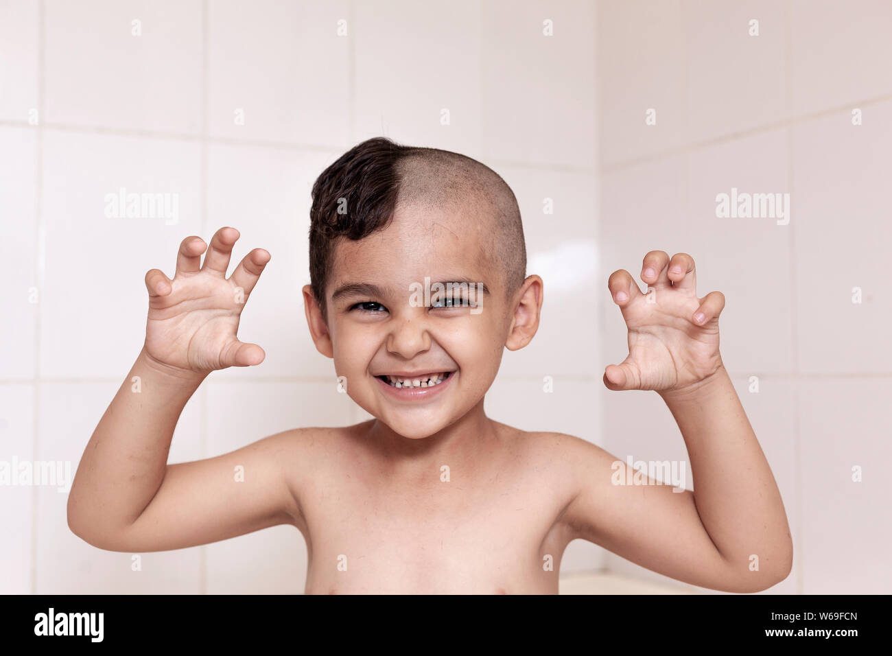 Portrait Of A Little Middle Eastern Boy At The Bathroom 6 Year Old Pretty Kid With Half Cut Hair At Home Stock Photo Alamy