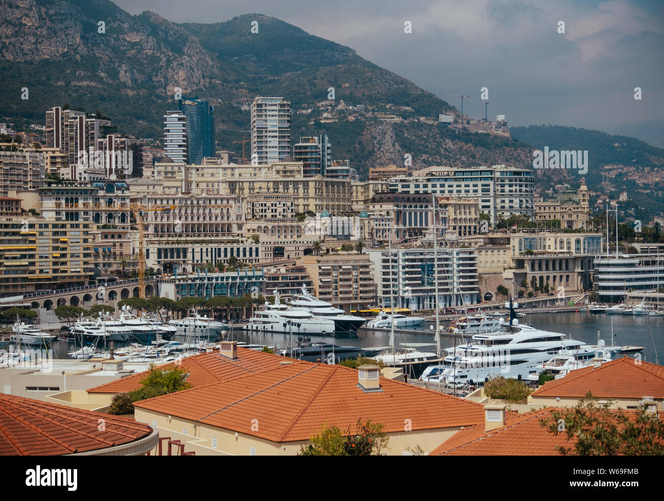 Yachts and ships in the port of Monaco pier pier boats sails and passenger ships in the background of the houses of Monte Carlo Stock Photo