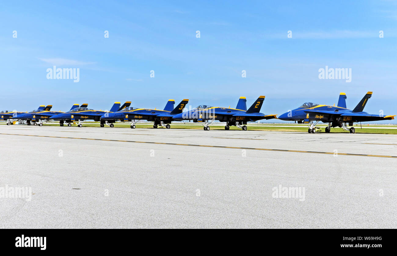 U.S. Navy Blue Angels, known for their precision flight demonstrations, are lined up at Burke Lakefront Airport in Cleveland, Ohio before a show. Stock Photo