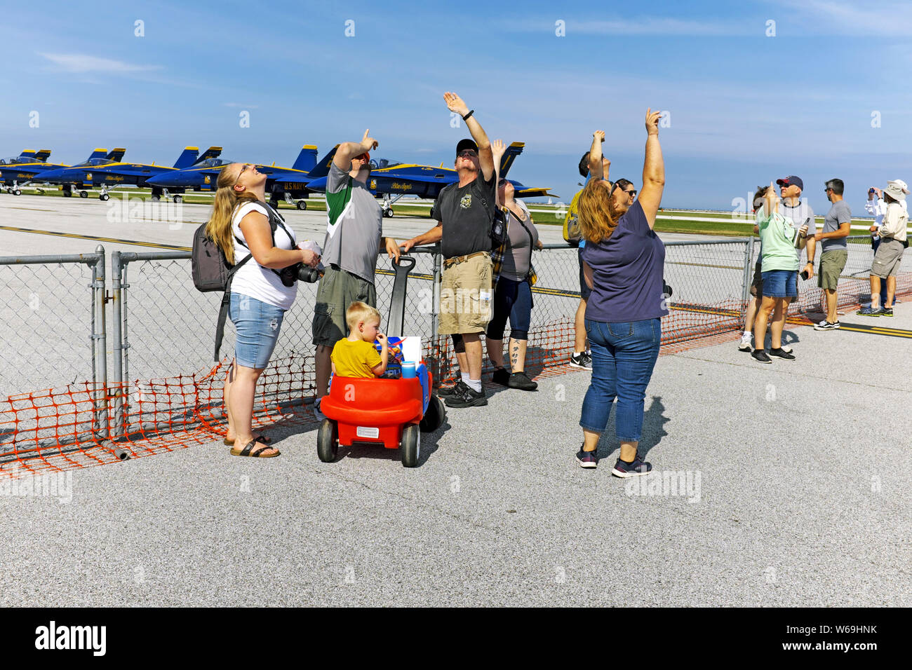 People attending the 2018 National Air Show in Cleveland, Ohio over the Labor Day weekend look to the skies to watch the air portion of the show. Stock Photo
