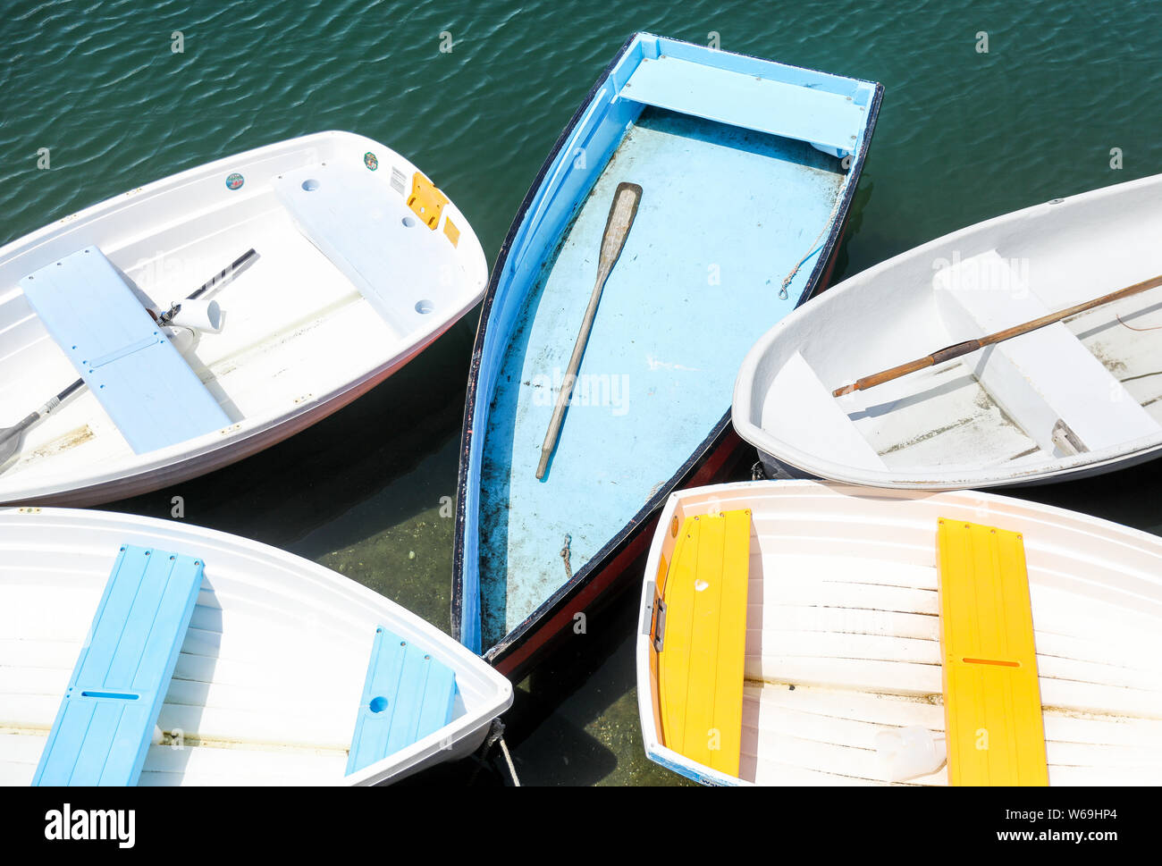 Colorful row boats or wooden dinghies parked at the dock Stock Photo ...