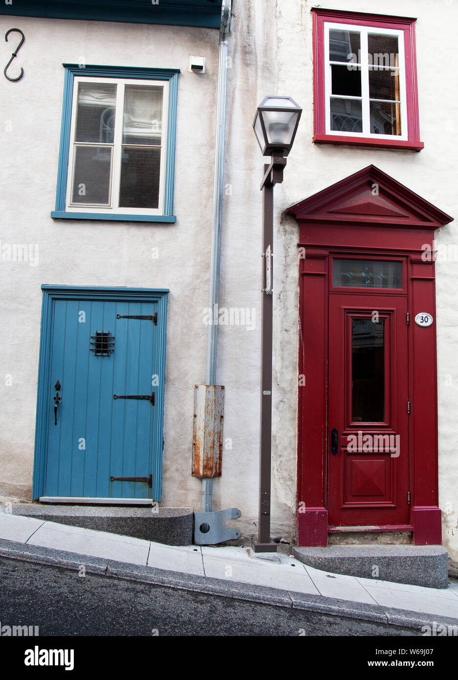 The oldest European settlement in North America, the walled city of Quebec, streets may go uphill, but the houses and house doors are straight. Stock Photo