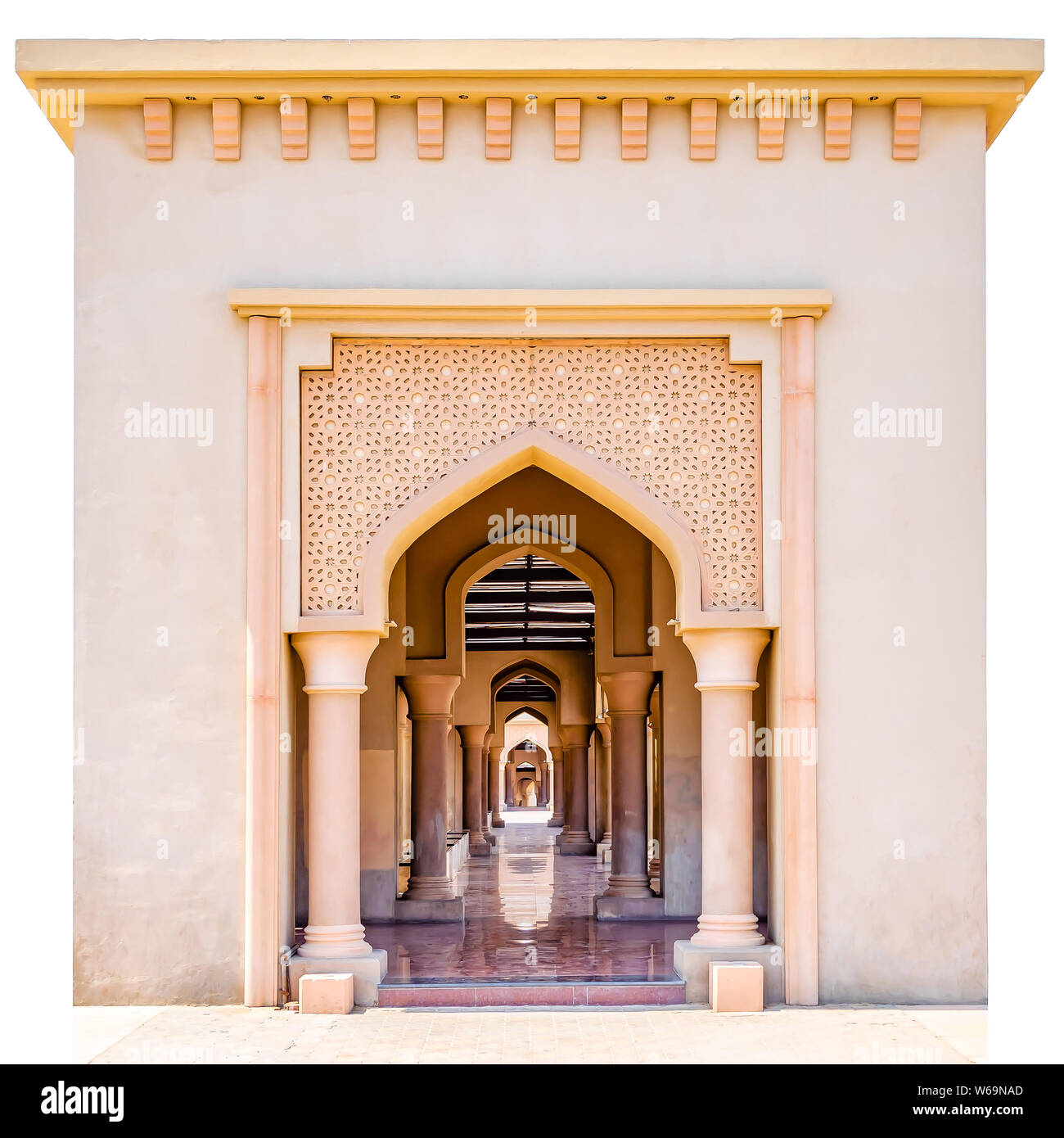 Beautiful arch with artistic patterns and the lengthy corridor with shining floor. Isolated. From Muscat, Oman. Stock Photo