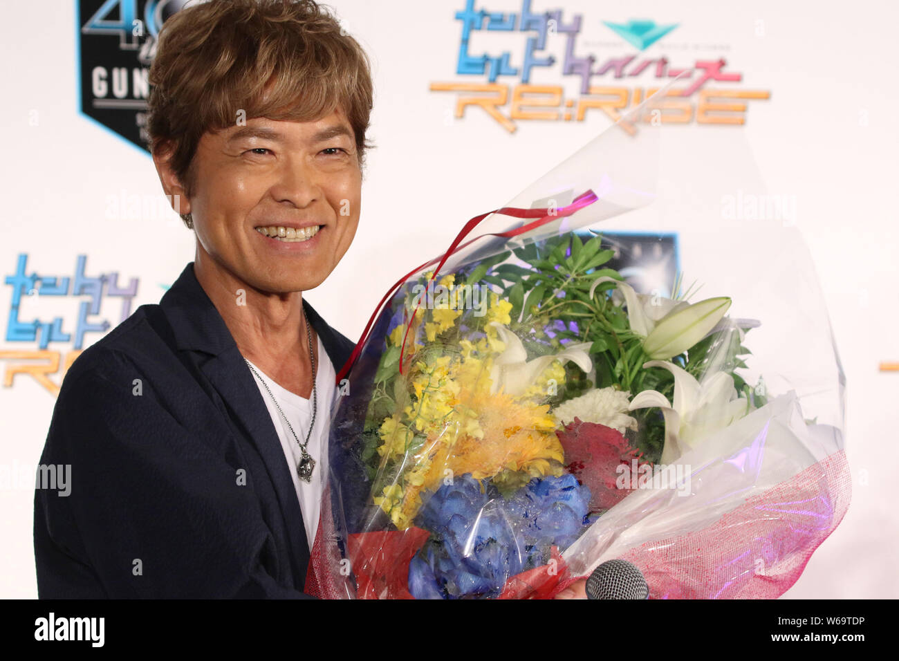 Tokyo Japan 31st July 19 Japanese Voice Actor Toru Furuya Receives A Flower Bouquet As He Turns The 66 Year Old At A Promotional Event Of The New Gundam Animation Series And Launching Of