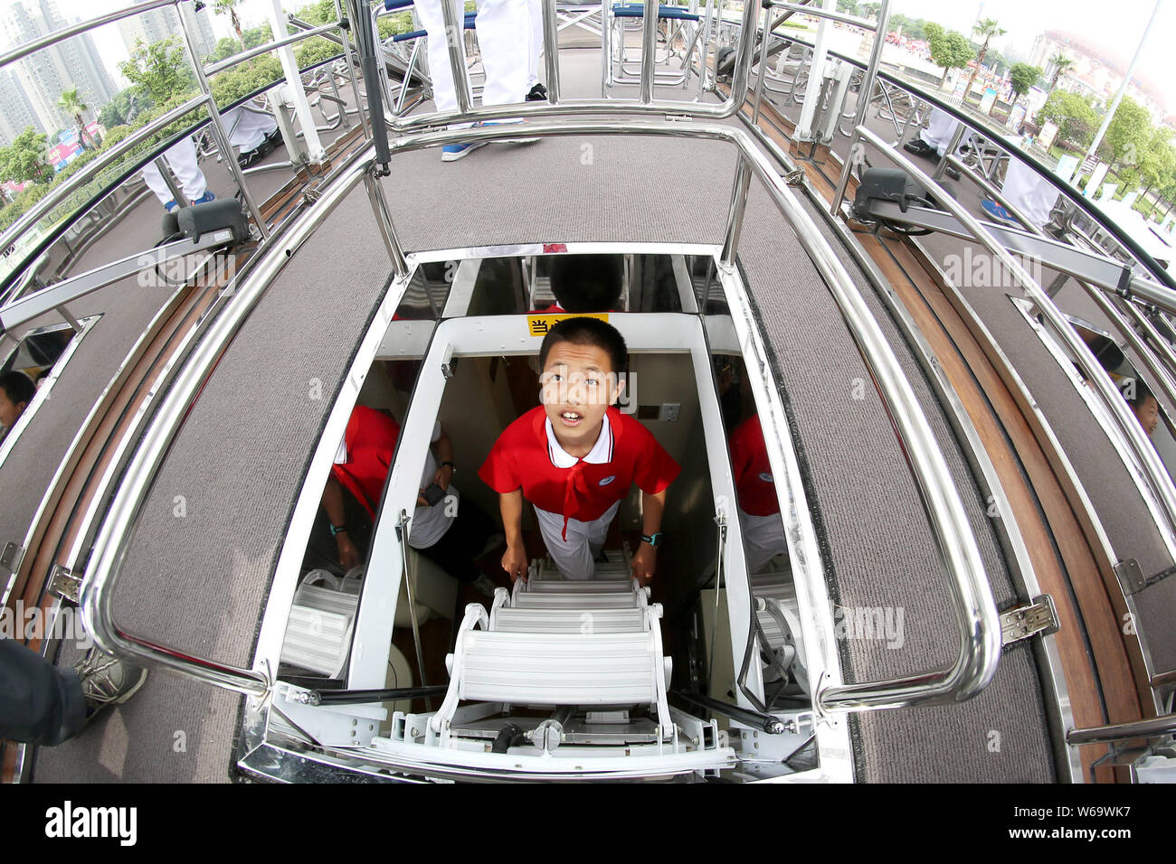 People visit the roof of a luxury recreational vehicle (RV) designed by German industrial designer Luigi Colani in Changzhou city, east China's Jiangs Stock Photo