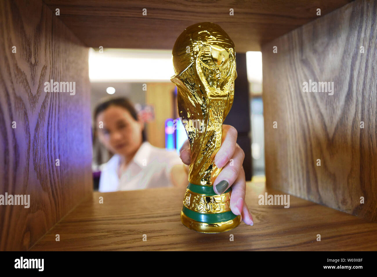 A Chinese room attendant works at a World Cup-themed room launched by a hotel to preheat the upcoming 2018 FIFA World Cup in Thousand Island Lake area Stock Photo