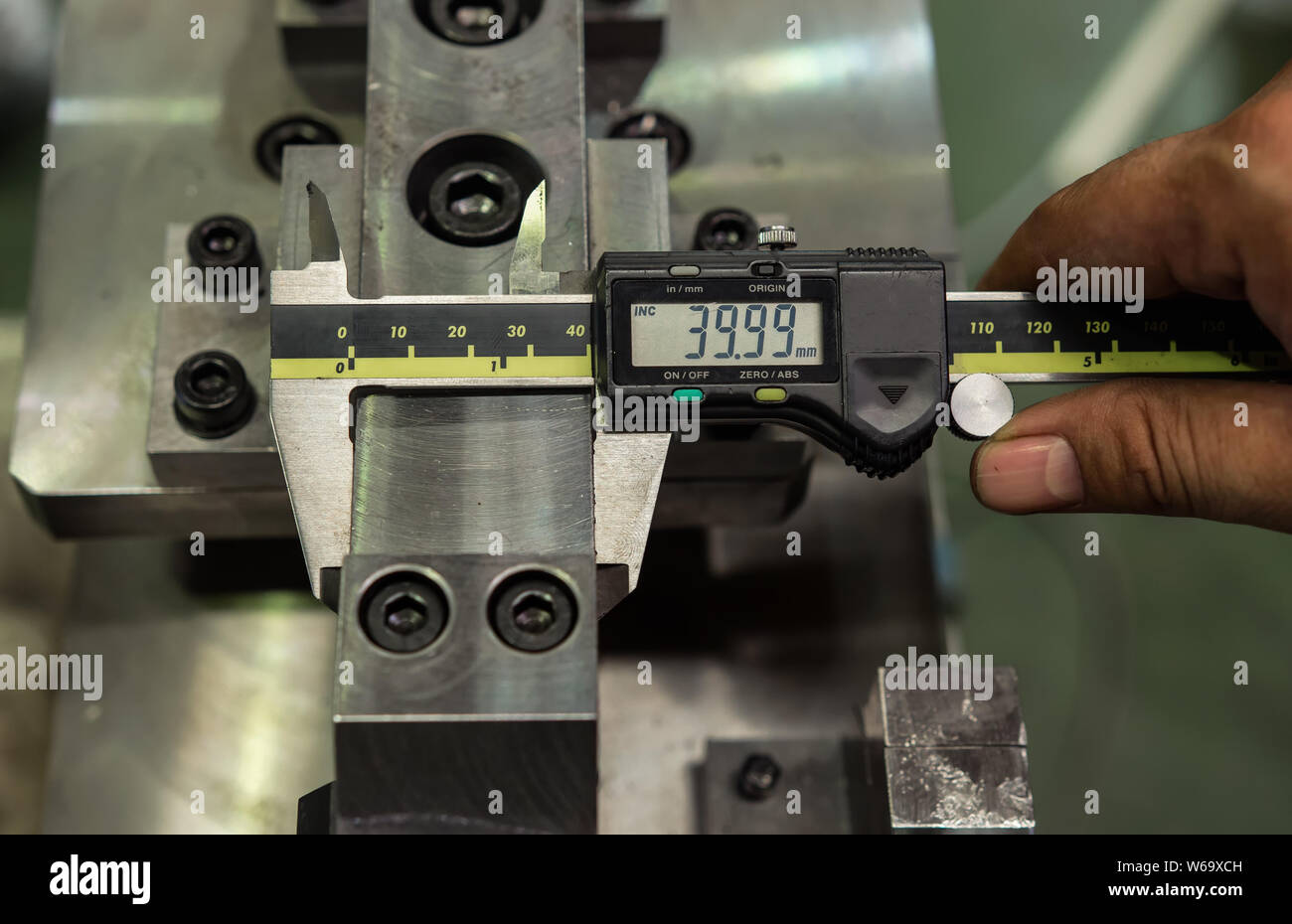 Vernier caliper measure diameter of locate pin in jig fixture structure