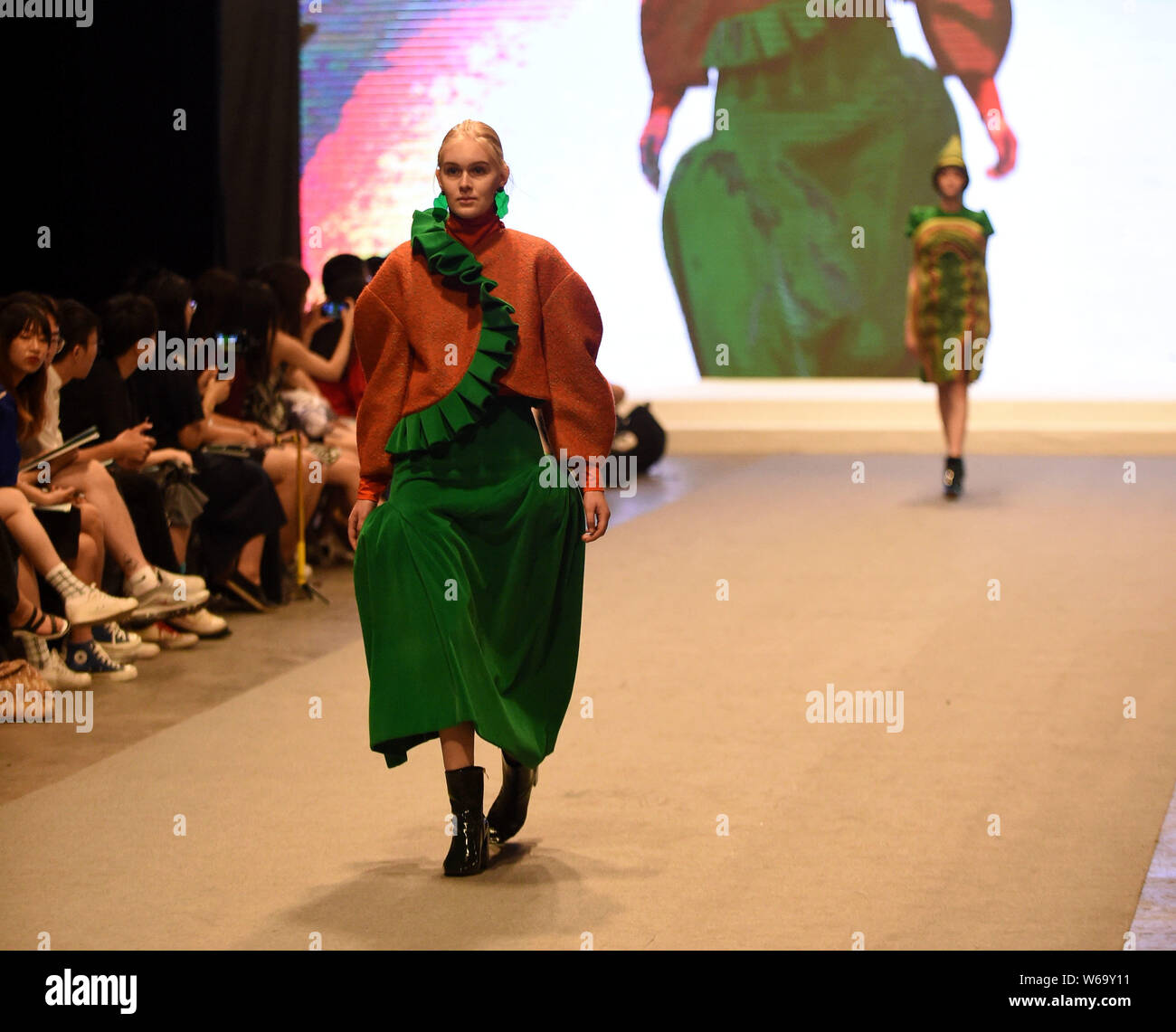 A model displays a new creation by a graduate during a fashion show for ...
