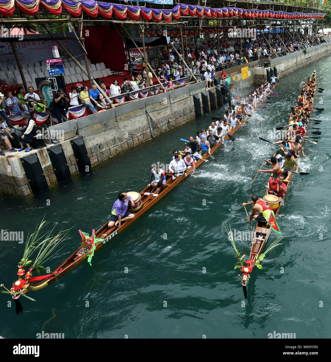 Participants compete in a dragon boat race held to celebrate the Dragon
