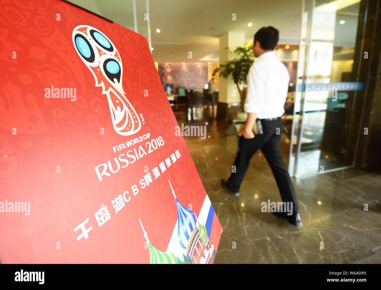 A customer enters a hotel that launches World Cup-themed rooms to preheat the upcoming 2018 FIFA World Cup in Thousand Island Lake area of Hangzhou ci Stock Photo