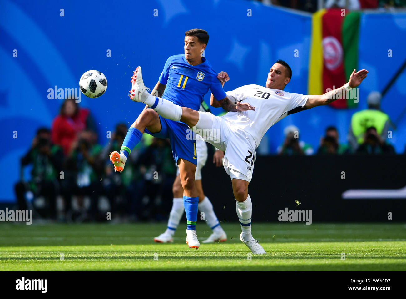 David Guzman, right, of Costa Rica kicks the ball to make a pass against Philippe Coutinho of Brazil in their Group E match during the FIFA World Cup Stock Photo