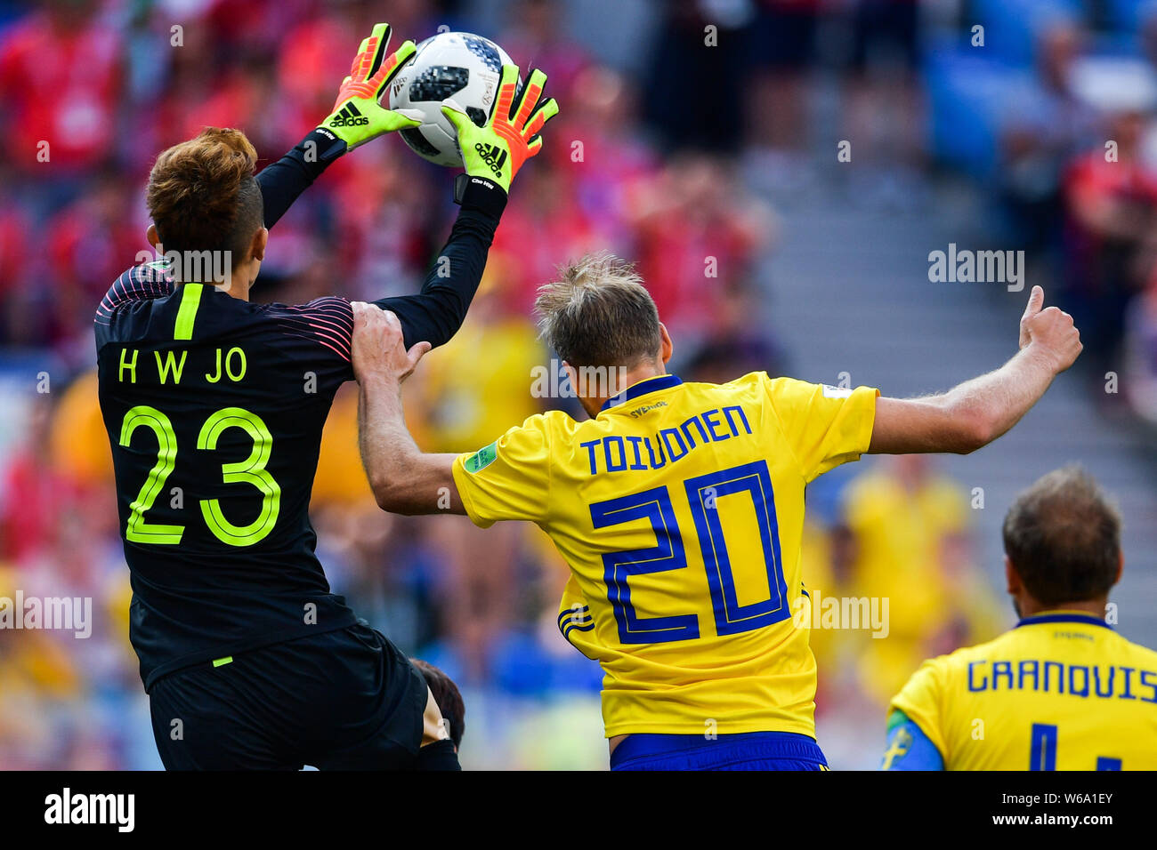 Ola Toivonen of Sweden, center, challenges goalkeeper Cho Hyun-woo or Jo Hyun-woo of South Korea in their Group F match during the FIFA World Cup 2018 Stock Photo