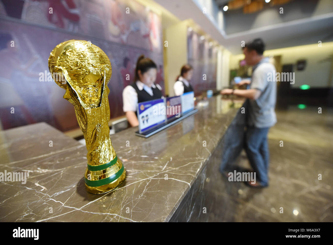 A customer check in at a hotel that launches World Cup-themed rooms to preheat the upcoming 2018 FIFA World Cup in Thousand Island Lake area of Hangzh Stock Photo