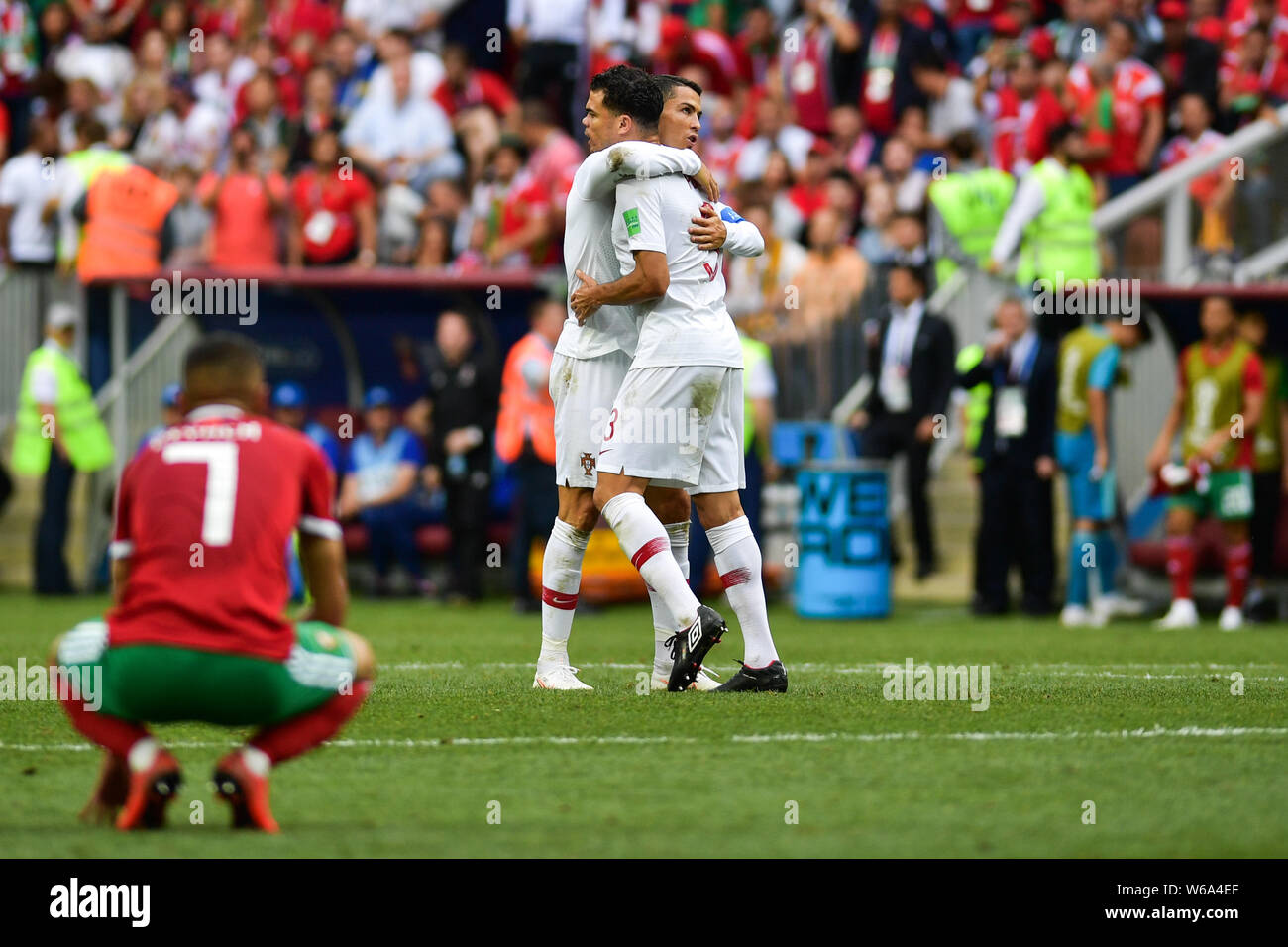 Cristiano Ronaldo of Portugal, back, celebrates with Pepe after defeating Morocco in their Group B match during the 2018 FIFA World Cup in Moscow, Rus Stock Photo
