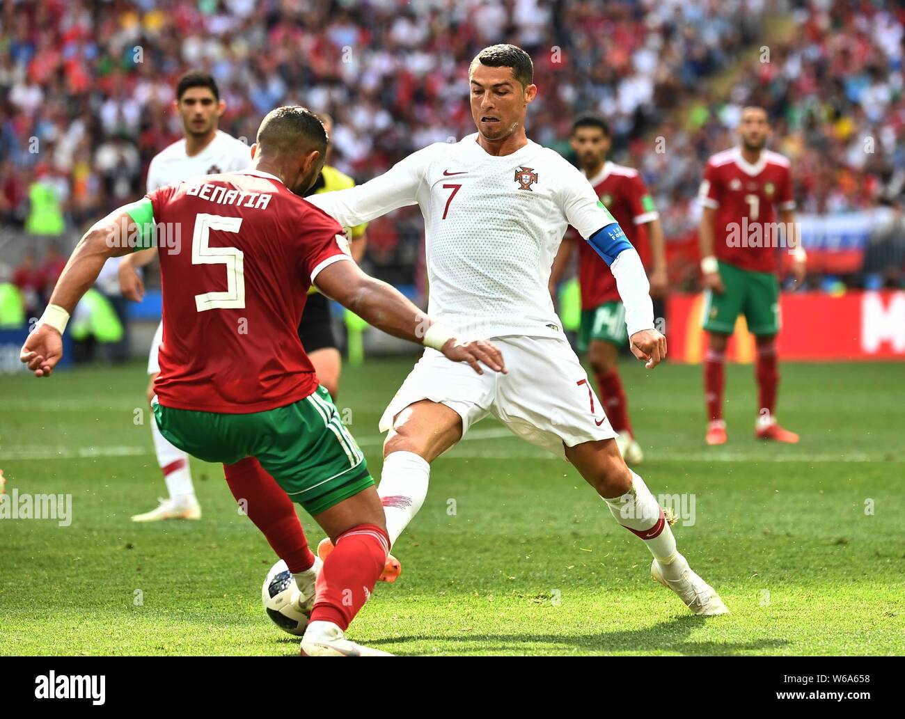 Cristiano Ronaldo of Portugal, right, challenges of Medhi Benatia of Morocco in their Group B match during the 2018 FIFA World Cup in Moscow, Russia, Stock Photo