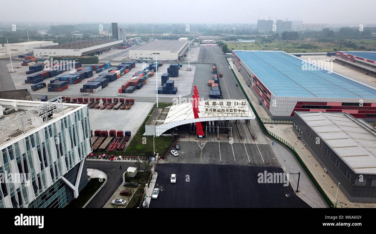 Cargo containers shipped by freight trains of the China-Europe Railway Express are stacked at the Chengdu Railway Port Multimodal Transport Customs Su Stock Photo