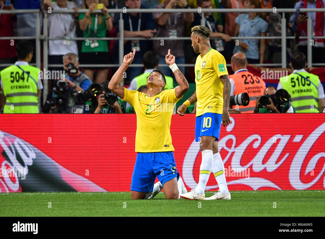 Thiago Silva, left, of Brazil kneels down to pray as he celebrates next to Neymar after scoring a goal against Serbia in their Group E match during th Stock Photo