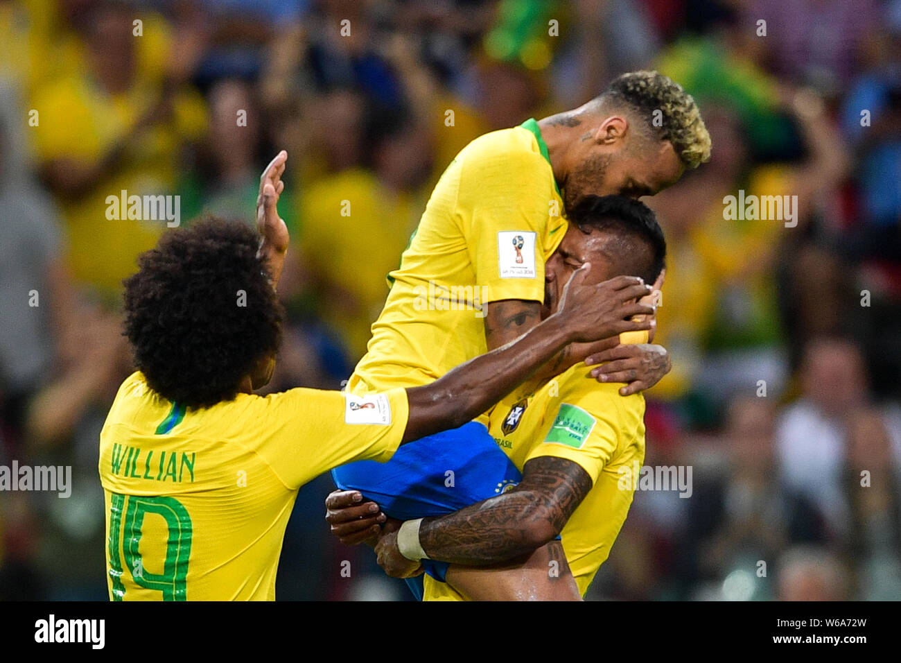 Paulinho, right, of Brazil celebrates with Neymar, top, and Willian after scoring a goal against Serbia in their Group E match during the FIFA World C Stock Photo