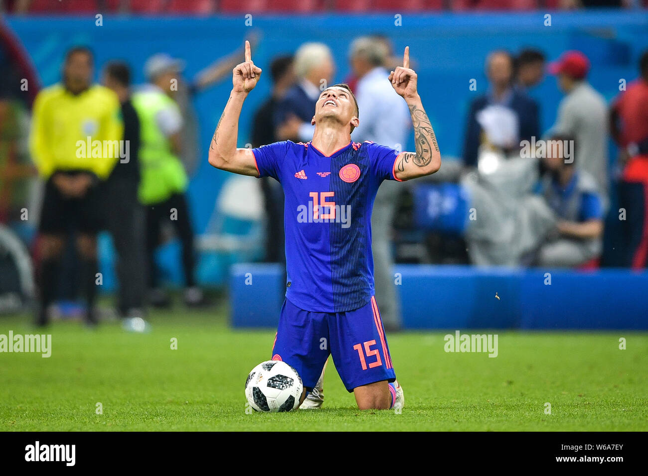 Mateus Uribe of Colombia kneels down and prays to celebrate after his team defeated Poland in their Group H match during the FIFA World Cup 2018 in Ka Stock Photo